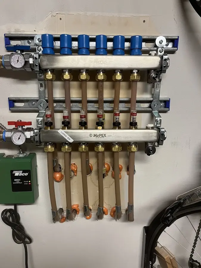 Plumber performing Water Heater Repair at a residential property in Enoch